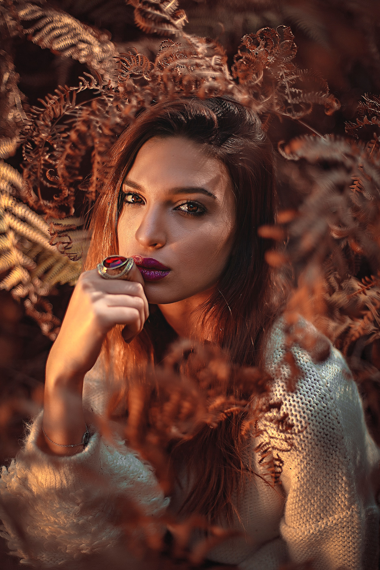 Woman wearing a red-stone ring